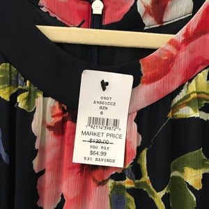 NEW WITH TAGS JUMPSUIT IN FLORAL PRINT